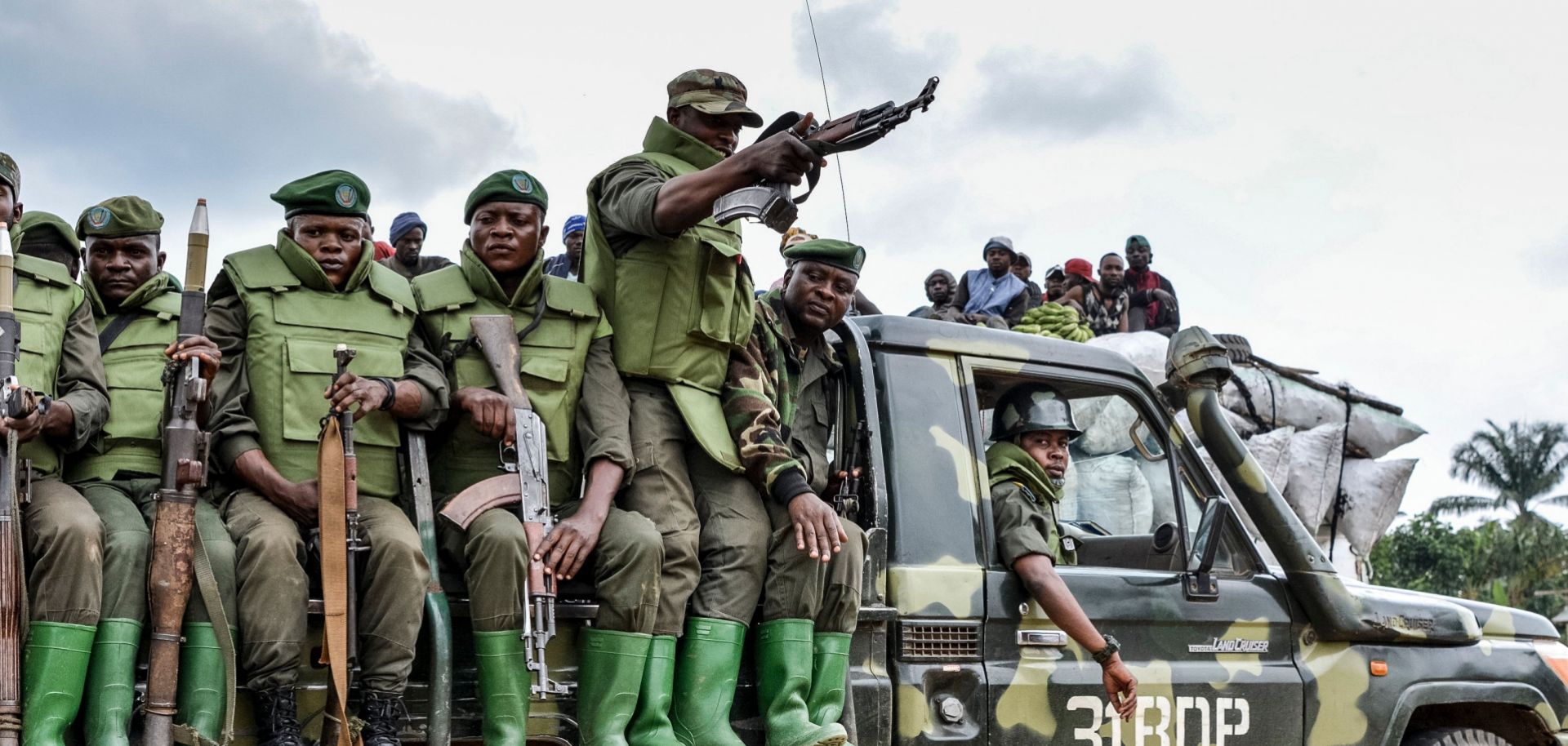 FARDC Officer Kills Governor's Aide, Mob Responds with Deadly Retaliation 60 soldiers of the fardc sit on military vehicle
