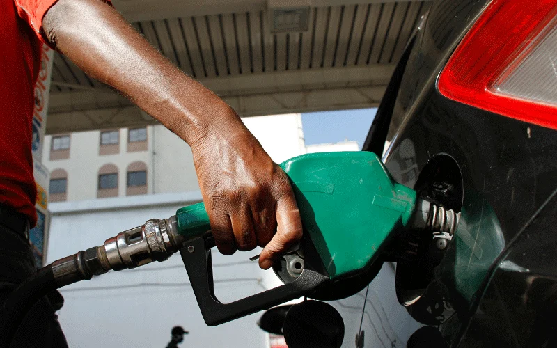 An attendant fuels a car