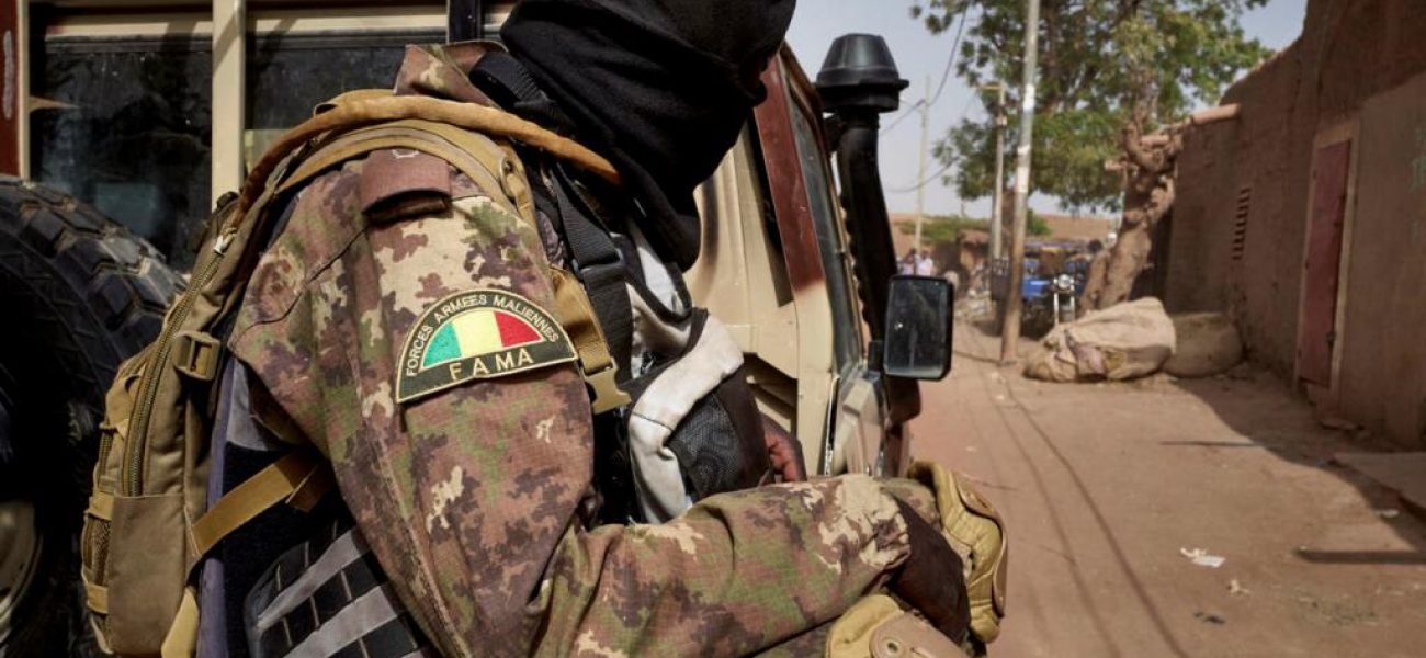 A soldier of the Malian army is seen during a patrol on the road between Mopti and Djenne, in central Mali, on February 28, 2020. - A week earlier Mali's Prime Minister announced the dismantling of the security checkpoints organized by the traditional militia hunters Dan Na Ambassagou from Dogon country. (Photo by MICHELE CATTANI / AFP)