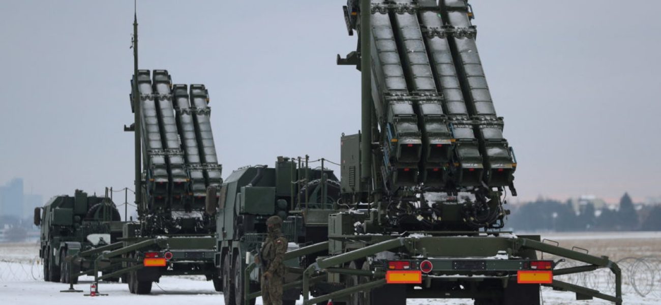 Serviceman patrols in front of the Patriot air defence system during Polish military training on the missile systems at the airport in Warsaw, Poland February 7, 2023. REUTERS/Kacper Pempel