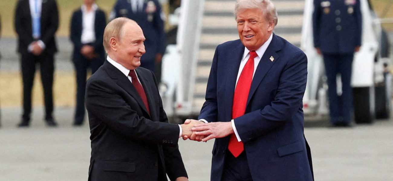 FILE PHOTO: U.S. President Donald Trump shakes hand with Russian President Vladimir Putin, as they meet to negotiate for an end to the war in Ukraine, at Joint Base Elmendorf-Richardson in Anchorage, Alaska, U.S., August 15, 2025. REUTERS/Kevin Lamarque/File Photo
