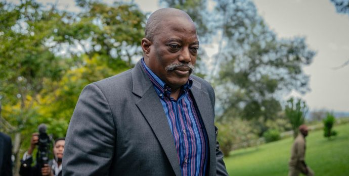 Former President of the Democratic Republic of Congo Joseph Kabila walks back into his house after posing for a group photo with religious leaders at one of his residences in Goma on May 29, 2025. Ex-president Joseph Kabila was back in the Democratic Republic of Congo on May 29, 2025 via Goma, an eastern city seized by the Rwanda-backed M23 militia whose lightning offensive the government accuses him of orchestrating.
Kabila's appearance comes despite the former president facing the possibility of a treason trial over his alleged support for the M23, which has seized swathes of the resource-rich Congolese east with Rwanda's help.
Felix Tshisekedi, his successor as the DRC's president, accuses Kabila of being the brains behind the armed group. (Photo by Jospin Mwisha / AFP)