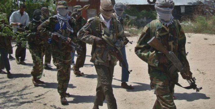 Al-Shabab recruits walk down a street in the Somalian capital, Mogadishu, following their graduation in 2012. The militant group has transformed from being just a Somali group to a regional network in East Africa.