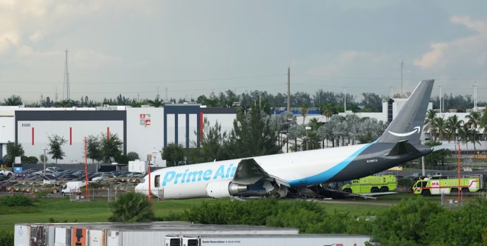 An Amazon cargo plane sits at the Miami International Airport (MIA) after it overshot the runway, Sunday, Sept. 6, 2026. (AP Photo/Lynne Sladky)