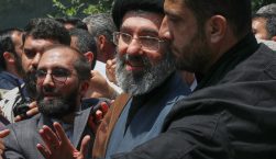 Mojtaba Khamenei, the son of Iran's Supreme Leader, Ayatollah Ali Khamenei, center, attends the annual Quds, or Jerusalem Day, rally in Tehran, Iran, May 31, 2019. (AP Photo/Vahid Salemi)