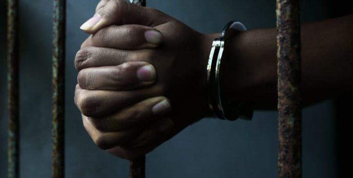 Black-Hands-Handcuffed-in-Prison