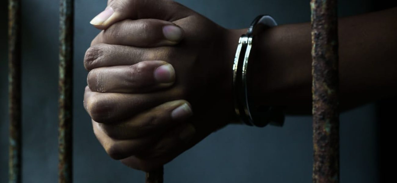 Black-Hands-Handcuffed-in-Prison