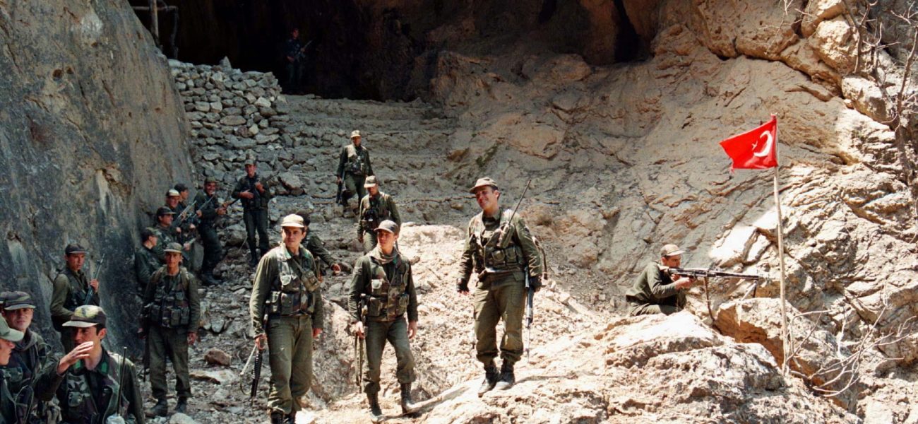 Turkish soldiers stand before a giant cave at the rugged Zap camp in the northern Iraq, 25 kms south of Turkish border, after they captured it from the Kurdish PKK rebels May 24. Turkish forces last week started a cross-border military operation in the northern Iraq used as a base by Kurdish rebels to attack their targets in Turkey.

TURKEY