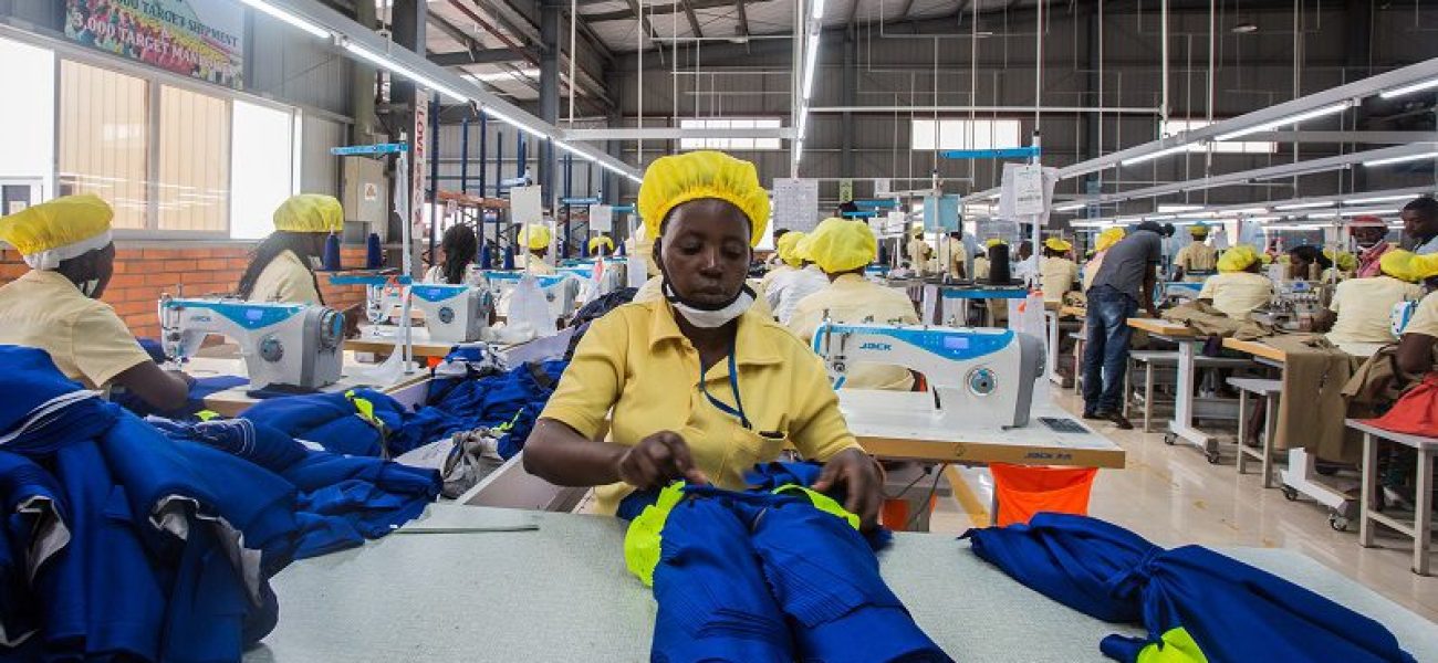 KIGALI, RWANDA - MAY 18, 2018: Employees at a Chinese-owned factory on the outskirts of Rwanda's capital, Kigali, prepare polyester polo shirts ahead of an increase in tariffs that will make Rwandan-made clothes costlier for U.S. distributors.