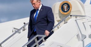 President Donald Trump exits Air Force One at Morristown Municipal Airport in Morristown, N.J., Friday, July 31, 2026, after a trip to Camp David, the presidential retreat. (AP Photo/Jacquelyn Martin)
