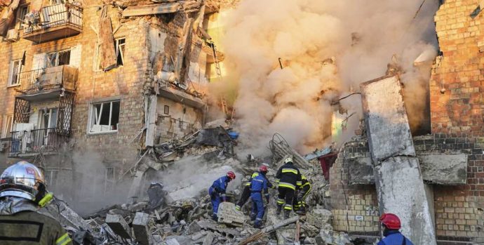 Firefighters work on the site of a burning building after a Russian attack in Kyiv, Ukraine, early Thursday, Aug. 28, 2025. (AP Photo/Efrem Lukatsky)