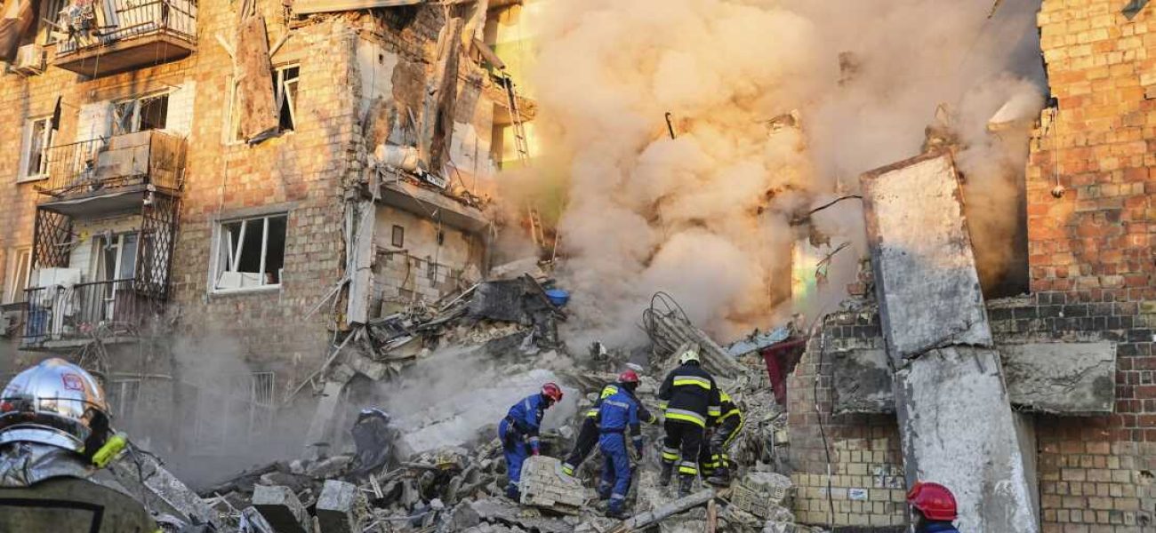 Firefighters work on the site of a burning building after a Russian attack in Kyiv, Ukraine, early Thursday, Aug. 28, 2025. (AP Photo/Efrem Lukatsky)