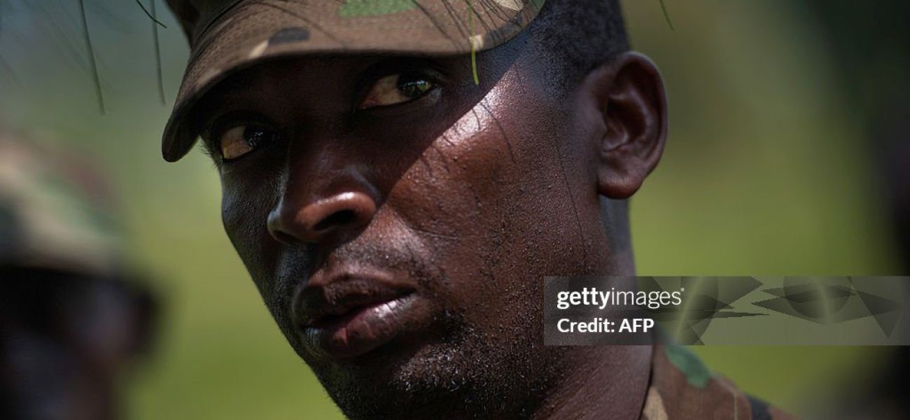 Colonel Innocent Kaina, a sector commander for M23 rebels on the front-lines near Goma, stands at a rebel position during an interview with journalists, near Goma, on the outskirts of the eastern Democratic Republic of Congo city on November 19, 2012. DR Congo's M23 rebels who have closed in on the main eastern city of Goma warned that they will continue their fight against the government unless it opens direct talks with them within 24 hours. The rebels said in a statement they will "pursue the resistance against the government of Kinshasa until it falls" unless it starts "direct political negotiations" with the insurgents within the next 24 hours and demilitarises Goma and the city's airport. AFP PHOTO/PHIL MOORE        (Photo credit should read PHIL MOORE/AFP via Getty Images)