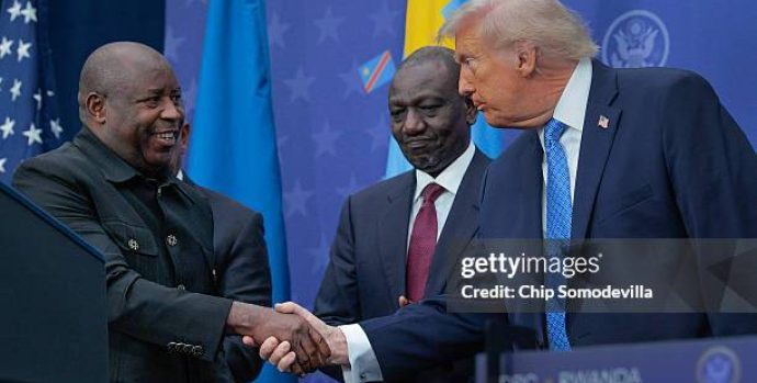 WASHINGTON, DC - DECEMBER 04: U.S. President Donald Trump greets  Kenyan President William Ruto (C) and Burundi President Evariste Ndayishimiye (L) at the Donald J. Trump Institute of Peace on December 04, 2025 in Washington, DC. As part of his campaign to portray himself as a peacemaker, Trump invited the African leaders to Washington to sign a peace and economic accord which aims to end decades of conflict between the Rwandan and Congolese governments, militias, rebel groups and other warring factions. The peace deal was initially signed in June of 2025 but Rwandan troops remain in the DRC and fighting continues. (Photo by Chip Somodevilla/Getty Images)