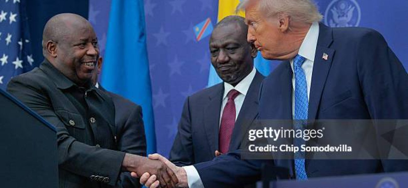 WASHINGTON, DC - DECEMBER 04: U.S. President Donald Trump greets  Kenyan President William Ruto (C) and Burundi President Evariste Ndayishimiye (L) at the Donald J. Trump Institute of Peace on December 04, 2025 in Washington, DC. As part of his campaign to portray himself as a peacemaker, Trump invited the African leaders to Washington to sign a peace and economic accord which aims to end decades of conflict between the Rwandan and Congolese governments, militias, rebel groups and other warring factions. The peace deal was initially signed in June of 2025 but Rwandan troops remain in the DRC and fighting continues. (Photo by Chip Somodevilla/Getty Images)