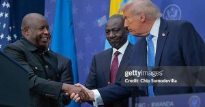 WASHINGTON, DC - DECEMBER 04: U.S. President Donald Trump greets  Kenyan President William Ruto (C) and Burundi President Evariste Ndayishimiye (L) at the Donald J. Trump Institute of Peace on December 04, 2025 in Washington, DC. As part of his campaign to portray himself as a peacemaker, Trump invited the African leaders to Washington to sign a peace and economic accord which aims to end decades of conflict between the Rwandan and Congolese governments, militias, rebel groups and other warring factions. The peace deal was initially signed in June of 2025 but Rwandan troops remain in the DRC and fighting continues. (Photo by Chip Somodevilla/Getty Images)