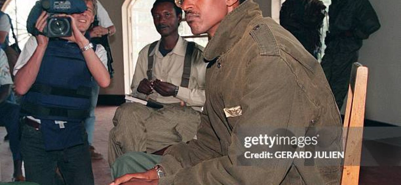 A picture taken 11 May 1994 in Buymba of Paul Kagame, leader of the Tutsi-led RPF (Rwandan Patriotic Front) during a meeting with UN High Commissioner for Human Rights Jose Ayala Lasso (not pictured). After a week that saw strained ties between Rwanda and France snap over an indictment call on President Paul Kagame over alleged complicity in the death of his predecessor, local media rallied in support of the government and poured scorn on Paris. French Foreign Minister Philippe Douste-Blazy 26 November 2006 said he regretted Rwanda's decision to cut diplomatic ties, forcing French envoys and educational staff to repatriate in haste.  AFP PHOTO / FILES GERARD JULIEN        (Photo credit should read GERARD JULIEN/AFP via Getty Images)
