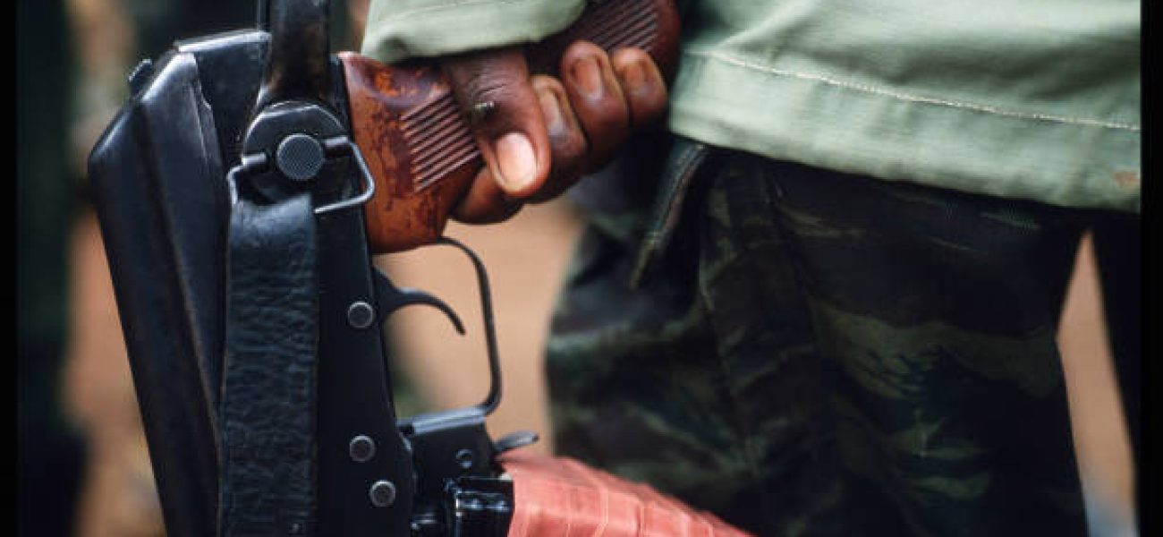 189913 34: A Rwandan Patriotic Front soldier holds a weapon captured at Kanombe May 26, 1994 in Kigali, Rwanda. Refugees flee the genocide of more than 800,000 Tutsis and Twas in the ongoing civil war. (Photo by Scott Peterson/Liaison)