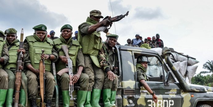 soldiers-of-the-fardc-sit-on-military-vehicle
