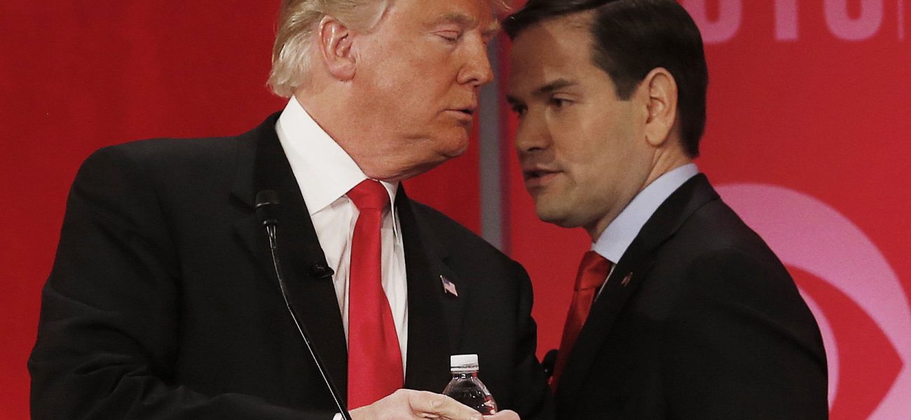 Republican presidential candidate, Sen. Marco Rubio, R-Fla., right, right, speaks to Republican presidential candidate, businessman Donald Trump  during a commercial break during the CBS News Republican presidential debate at the Peace Center, Saturday, Feb. 13, 2016, in Greenville, S.C. (AP Photo/John Bazemore)