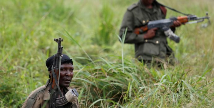 FILE PHOTO: Armed Forces of the Democratic Republic of the Congo (FARDC) soldiers rest next to a road after Islamist rebel group called the Allied Democratic Forces (ADF) attacked area around Mukoko village, North Kivu province of Democratic Republic of Congo, December 11, 2018.   REUTERS/Goran Tomasevic/File Photo