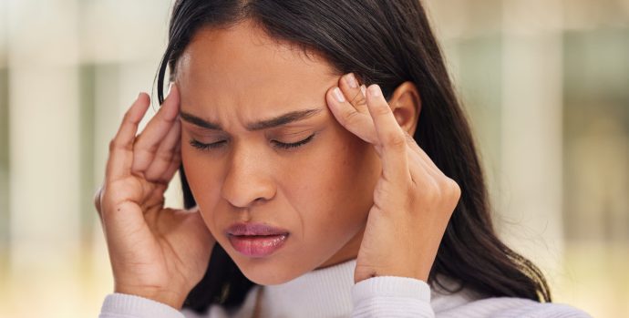 woman-face-and-stress-headache-in-city-from-start-2023-11-27-04-53-18-utc-scaled