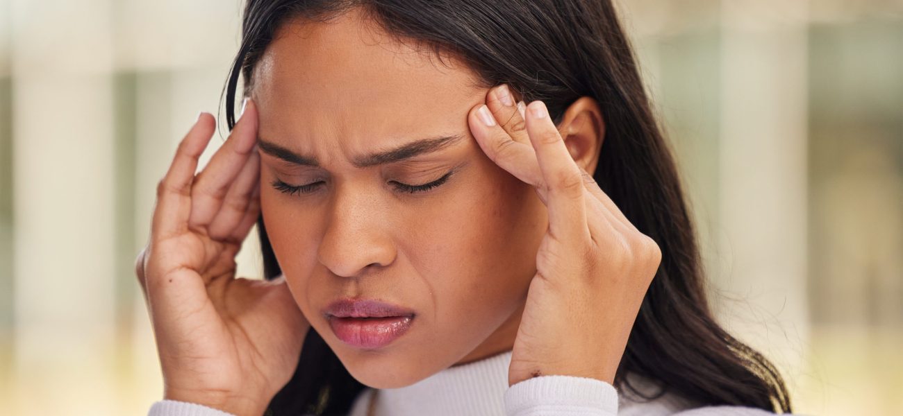 woman-face-and-stress-headache-in-city-from-start-2023-11-27-04-53-18-utc-scaled